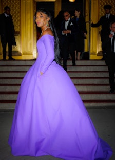 Naomi Campbell wearing a voluminous purple Valentino gown