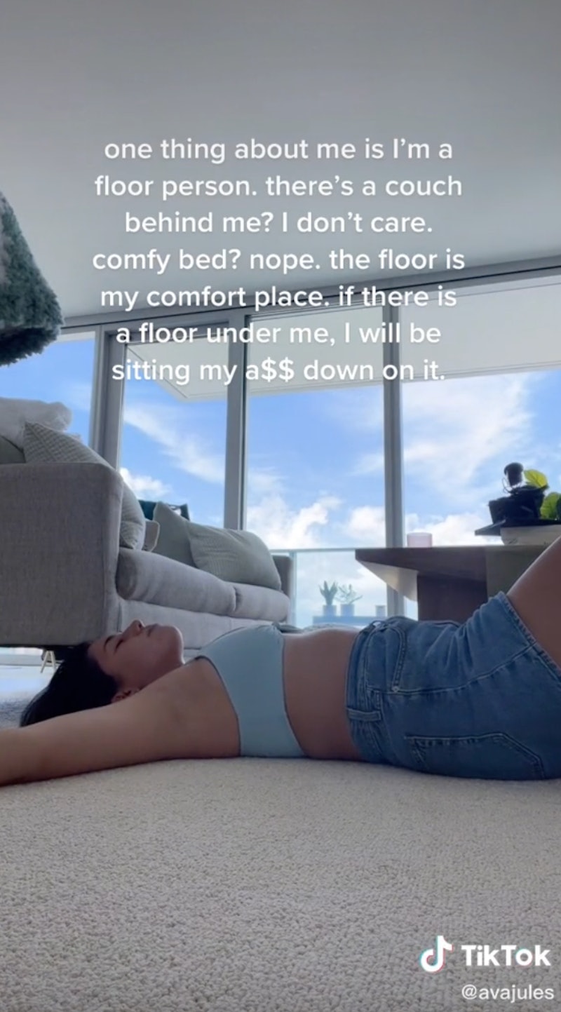 A woman lies on the floor in a TikTok #OneThingAboutMe challenge video where she declares herself a ...