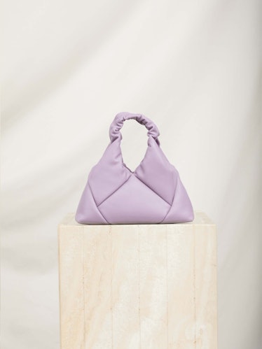 This purple patchwork mini bag from RECO is made from upcycled leather.