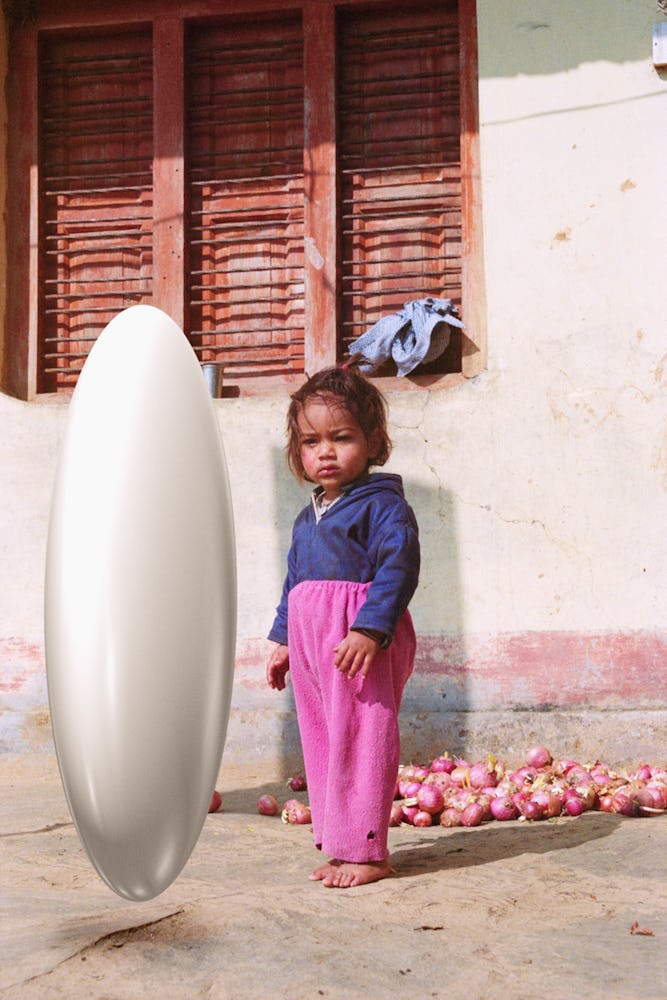 Michael Hauptman's photograph from Of Matter and Time with a little girls standing next to a white c...