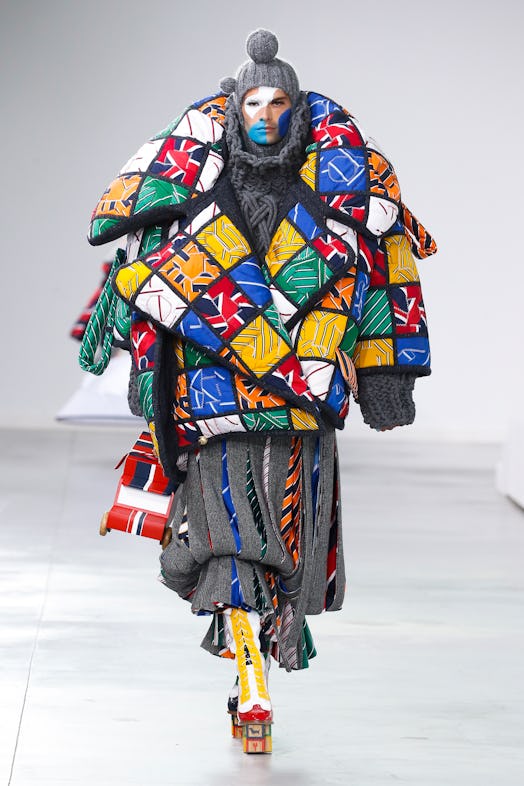 A model wearing a multicolored jacket at Thom Browne's fall 2022 show in New York City