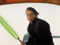Mark Hamill as Luke in Star Wars holding a light saber 