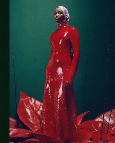 Photograph by Campbell Addy of a woman in a long red sequin dress and a pink headscarf