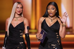 Dua Lipa and Megan Thee Stallion speak onstage during the 64th Annual GRAMMY Awards 