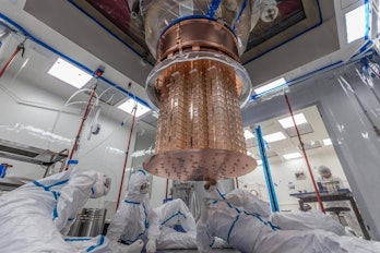 cuore detector being worked on by technicians. 