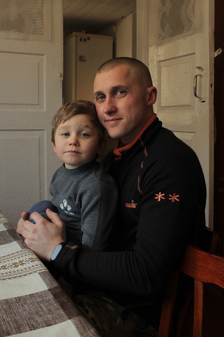 A little boy with his father in uniform, Ukraine.