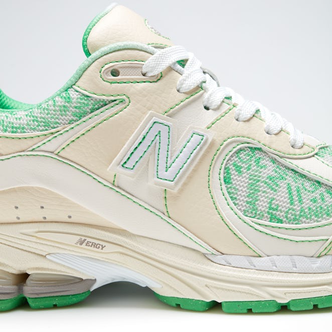 Ganni And New Balance collaboration On A Y2K Sneaker in green and beige from the side close up
