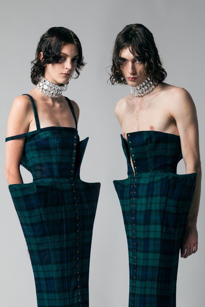 two models wearing tartan corset dresses