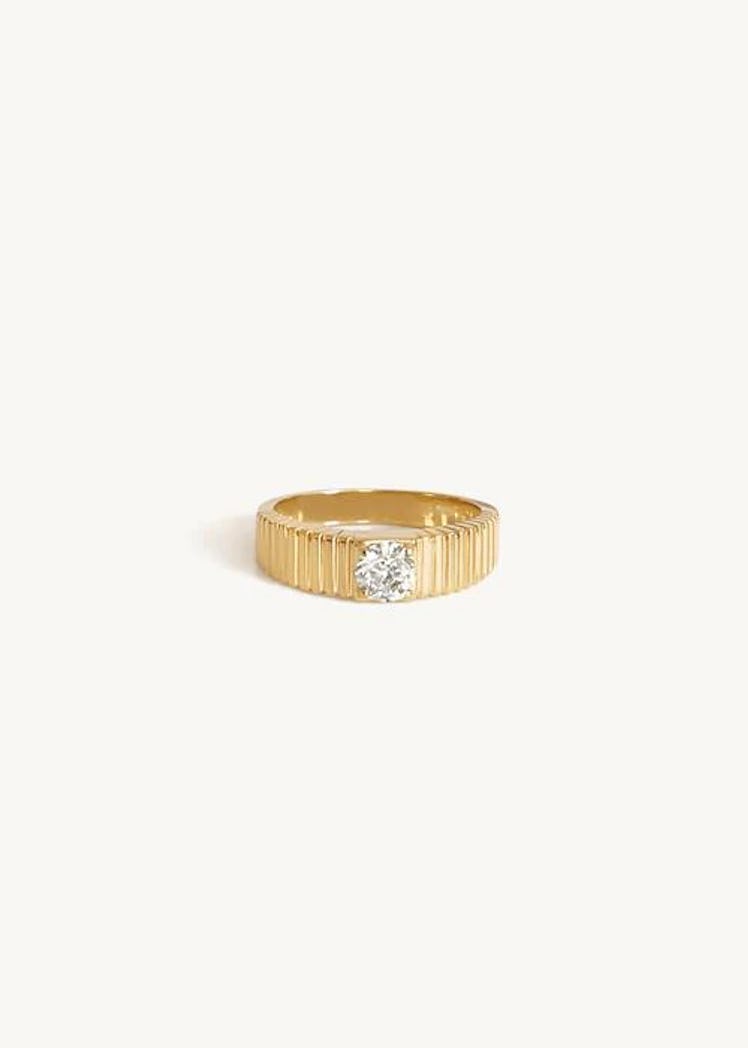 This gypsy set solitaire engagement ring from Kinn is made from recycled gold and locally sourced st...