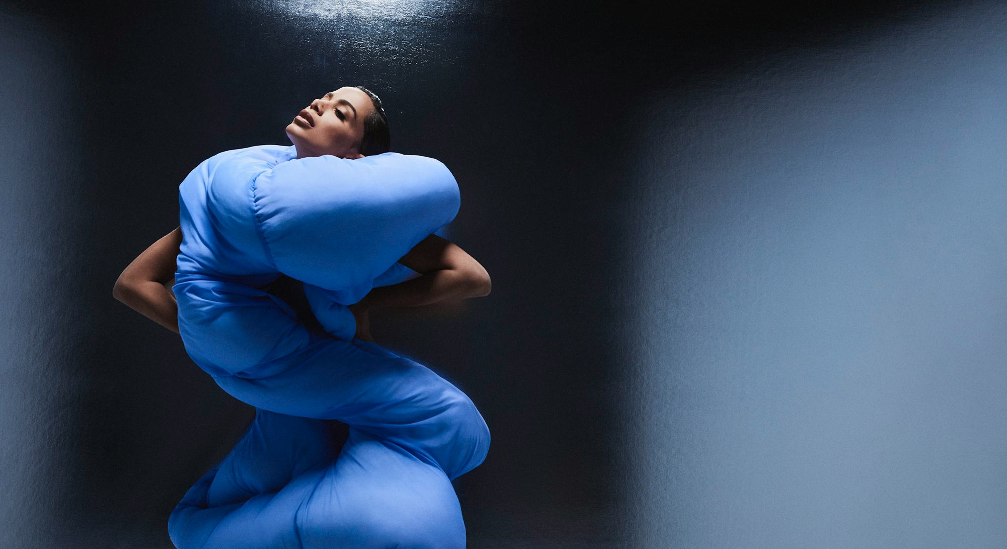 Anitta, the Brazillian pop star posing in a very puffy all over, blue dress