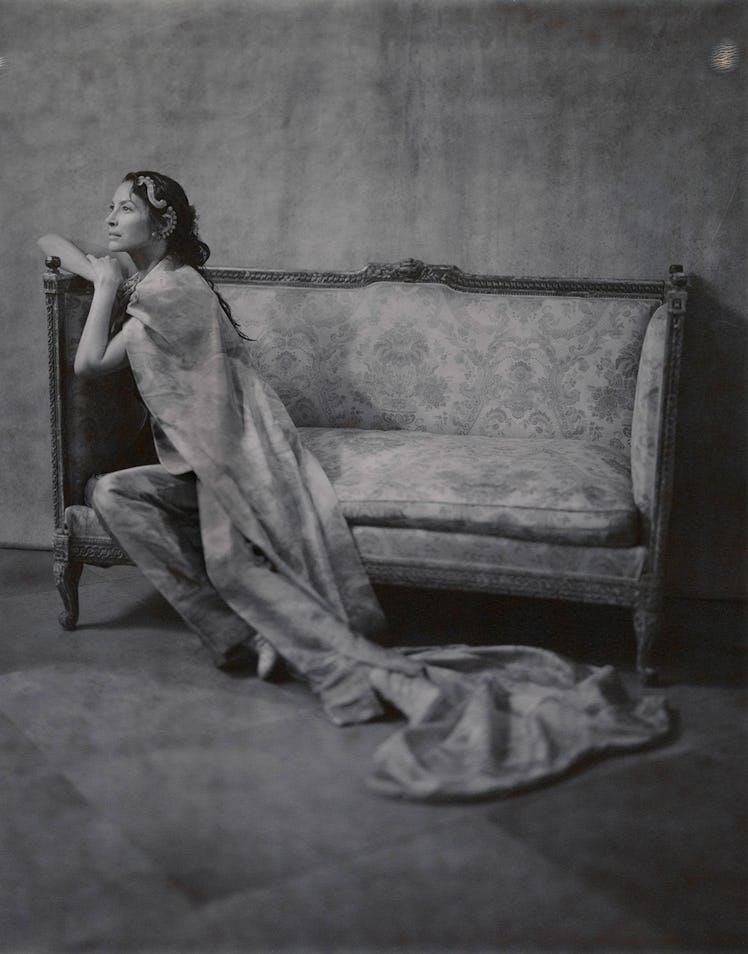 Christy Turlington sitting on a couch in a photo by Nikolai von Bismarck