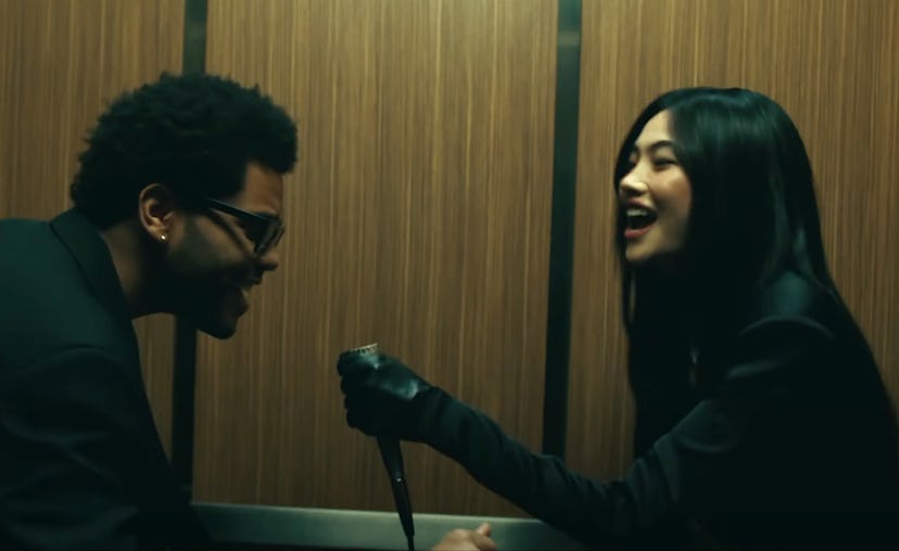 The Weeknd and HoYeon Jung doing karaoke in the 'Out of Time' music video