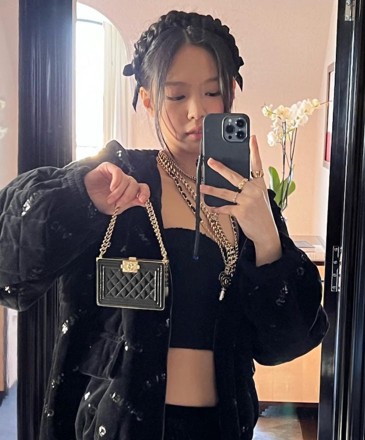 BLACKPINK's Jennie Kim wore a halo braid while attending the Chanel Womenswear Fall/Winter 2022/2023...
