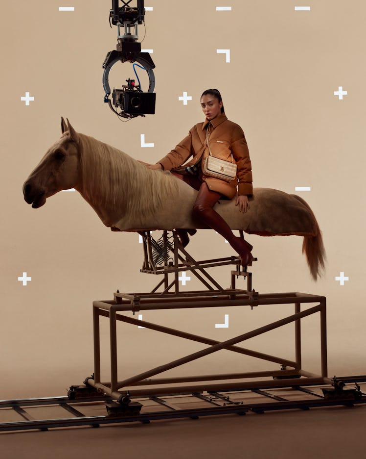 Lola Leon atop a fake horse in a Burberry campaign