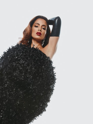 Anitta, the Brazillian pop star posing in a black Christian Siriano dress with black leather gloves ...