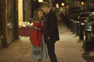 The main characters of About Time hugging on the street