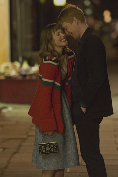 The main characters of About Time hugging on the street