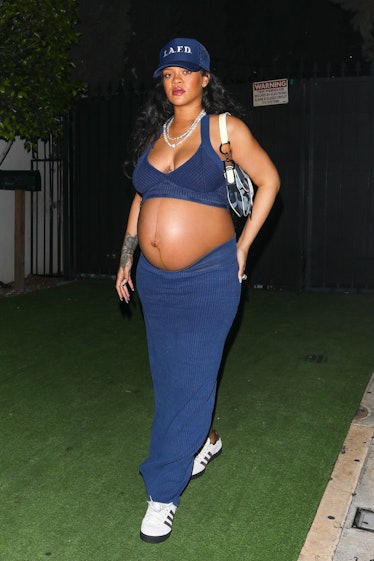 A pregnant Rihanna wearing an LAFD hat