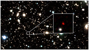 field of galaxies with a small region broken out to show a red object