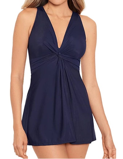 This nursing swimsuit features a swimdress design with tummy control.