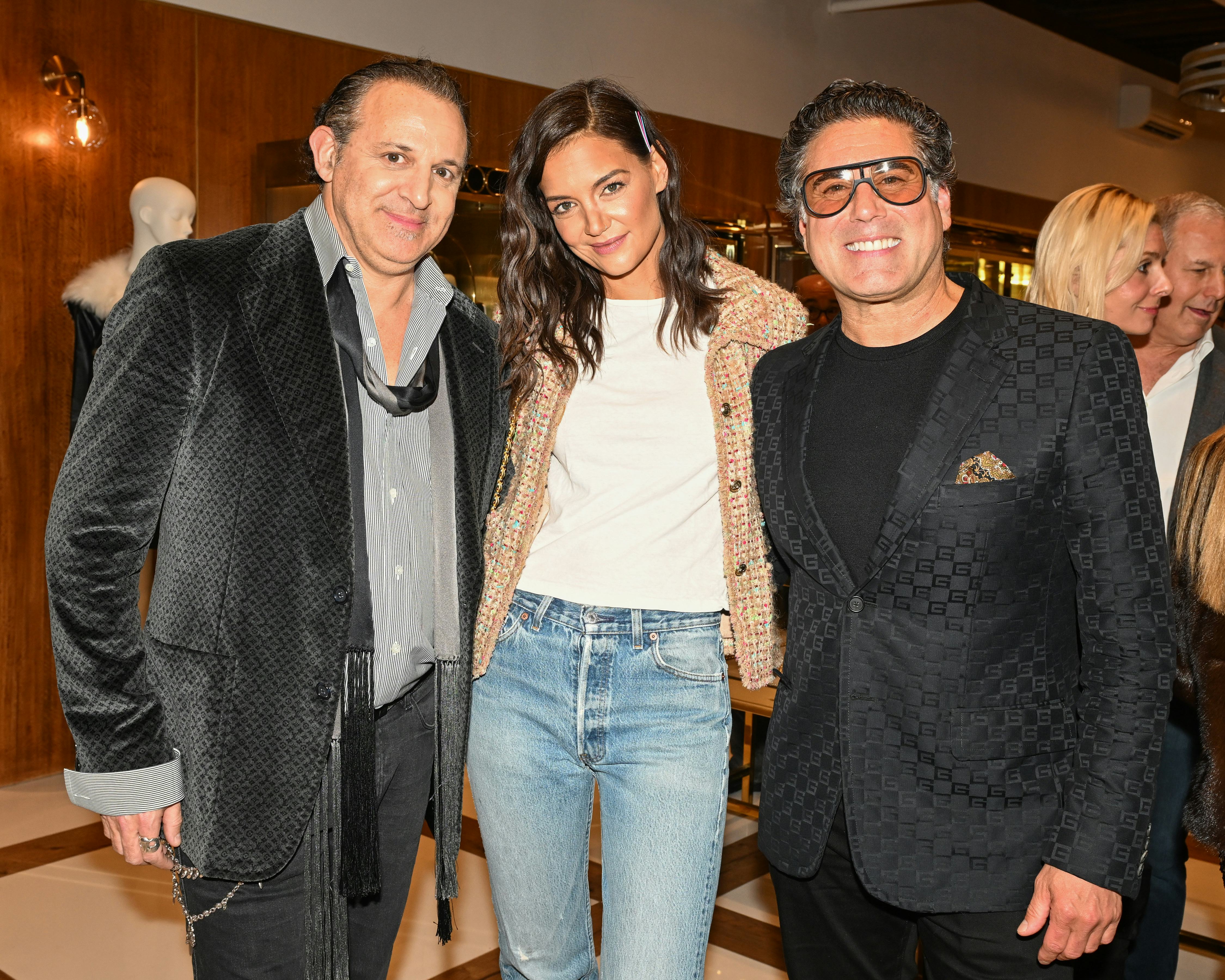 Katie Holmes with what goes around comes around co-owners Seth Weisser and Gerard Maione