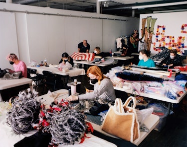 Nick Cave (standing) checks in with the team of studio assistants who are finalizing work for the tw...