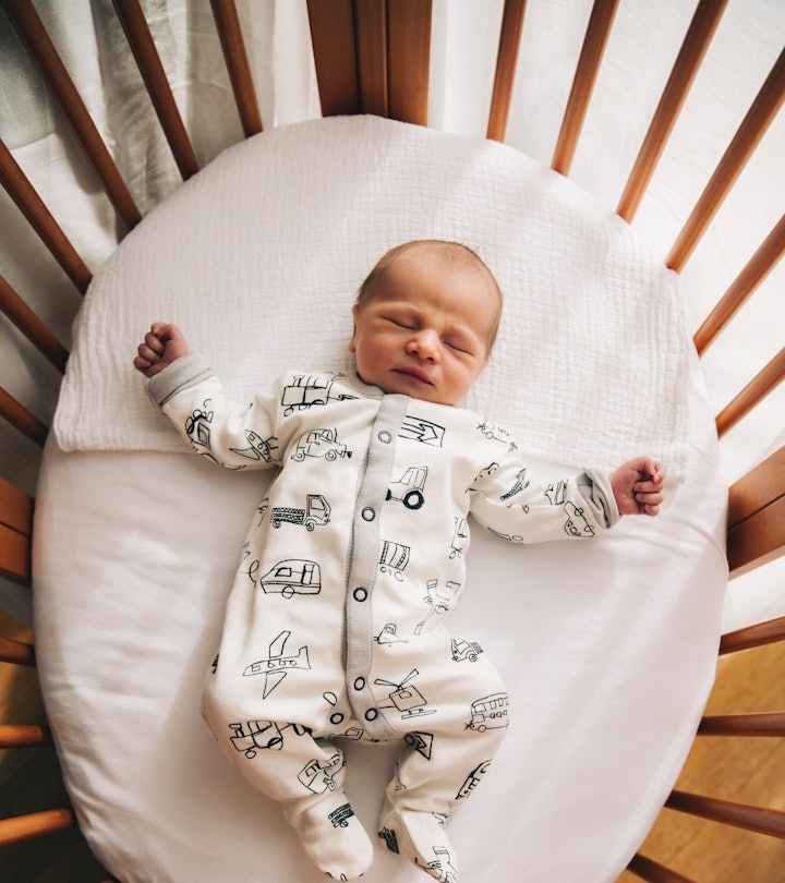 newborn baby safely sleeping in crib, when will baby start sleeping through the night? 