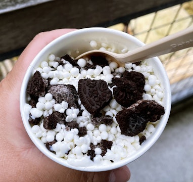 Cup of Dippin' Dots ice cream with Oreo chunks.