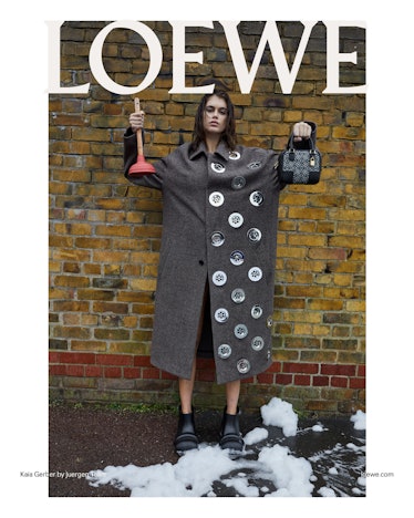 Kaia Gerber holding up a plunger and Loewe bag in a Loewe campaign