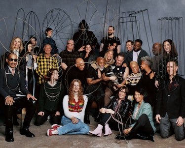 the artist Nick Cave poses with his friends and family in a group portrait
