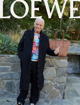 Anthony Hopkins gesturing at a Loewe tote in a Loewe campaign