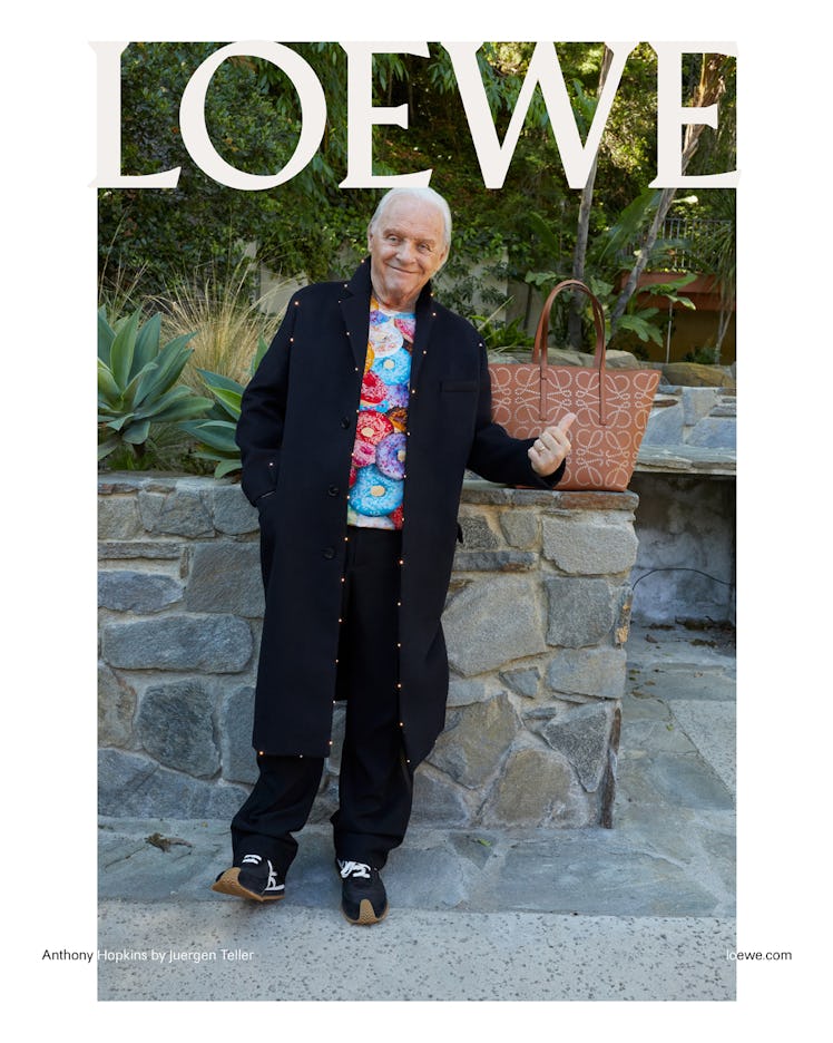 Anthony Hopkins gesturing at a Loewe bag in a Loewe campaign