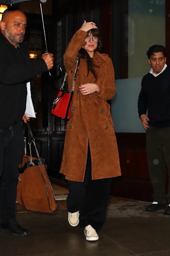 Dakota Johnson in black fur collar coat with brown Louis Vuitton bucket bag  in New York on February 1 ~ I want her style - What celebrities wore and  where to buy