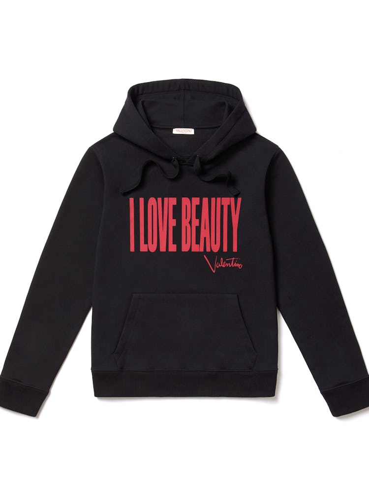 Black Valentino sweatshirt that reads "I Love Beauty" at the front in red. 