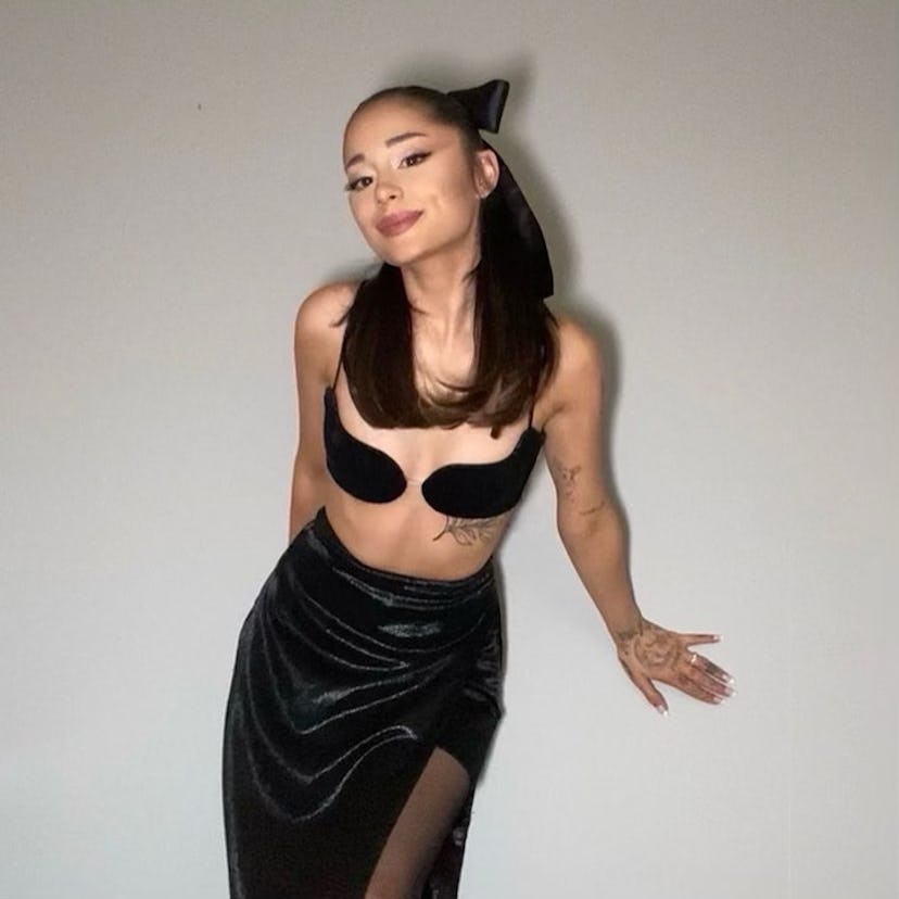 Ariana Grande posing in a black outfit