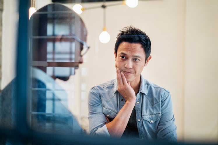 Man listening to boss in office