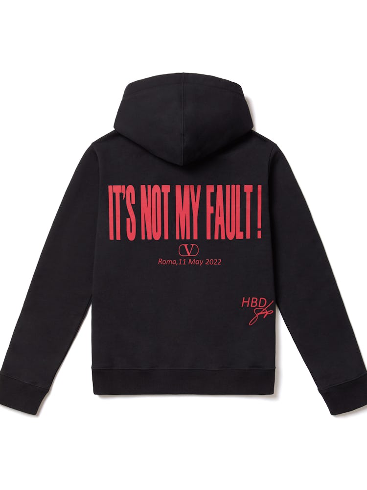 Black Valentino sweatshirt that reads "It's Not My Fault" on the back in red. 
