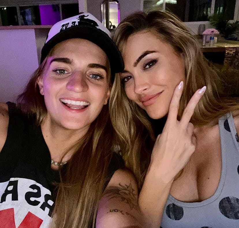 Chrishell Stause and G Flip met on set for the "Get Me Outta Here" music video, and their body langu...