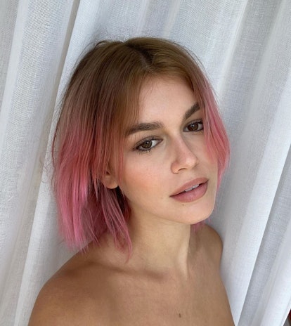 Kaia Gerber shows off pink ombré hair.