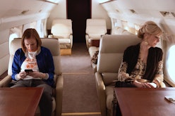 Ava and Deborah sitting on a private plane.