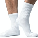 Close up of mans feet in white socks.