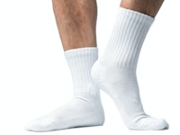 Close up of mans feet in white socks.