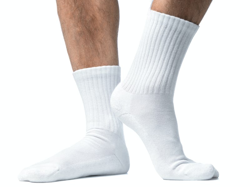 Close up of mans feet in white socks.