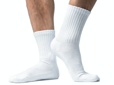 Close up of mans feet in white socks.