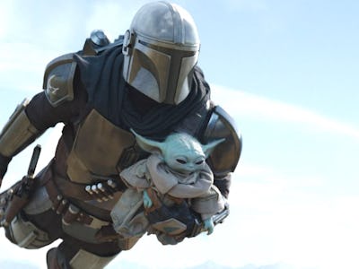 An insert with Mandalorian carrying baby Yoda.