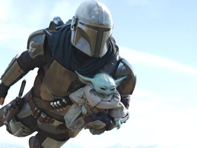 An insert with Mandalorian carrying baby Yoda.