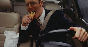 Man eating fries.
