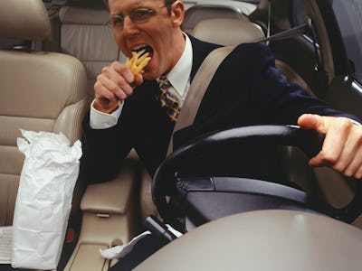 Man eating fries.