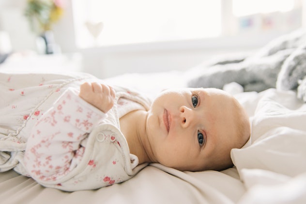 baby lying on bed, these baby names like evelyn in sound and meaning 