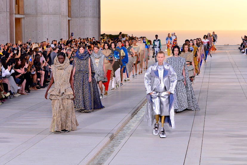 Models walk the runway of the Louis Vuitton cruise 2023 show